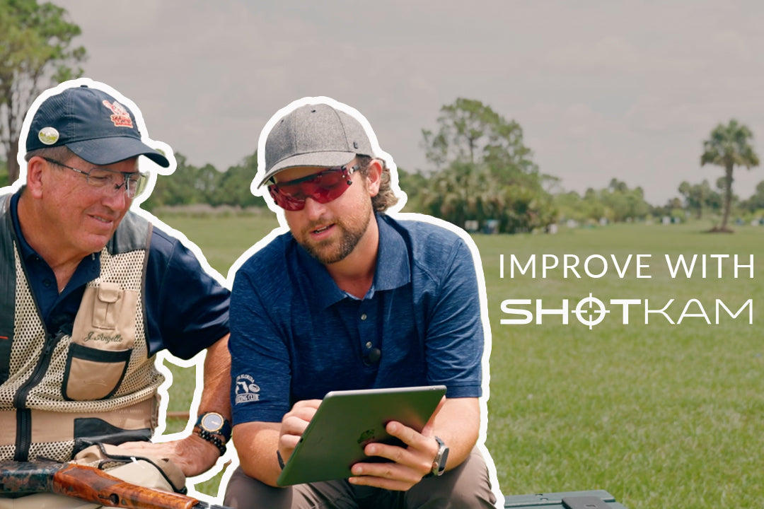 Australian shooting tips: Two shooters reviewing ShotKam footage on a tablet, learning how to improve their shooting performance.
