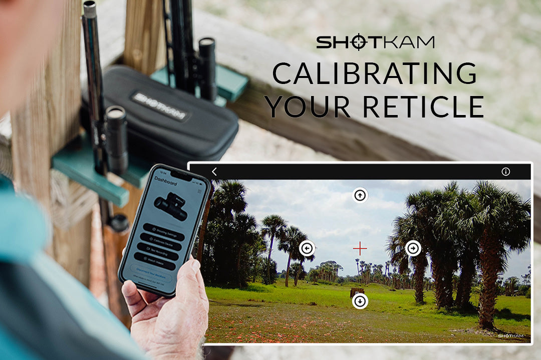 Australian shooter using the ShotKam mobile app to calibrate reticle settings, with a background of a sunlit shooting range lined with palm trees.