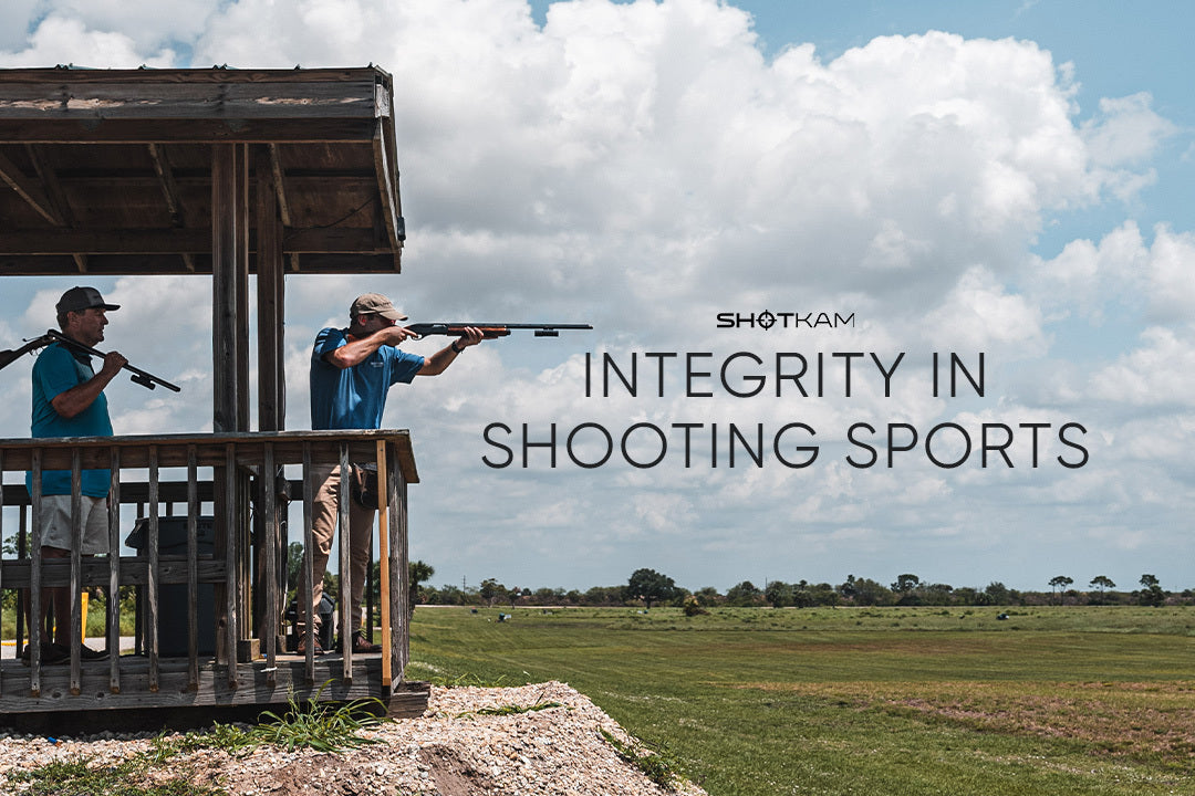 Integrity in shooting sports depicted as two Australian shooters aim at clay targets, using ShotKam cameras at a rural shooting range.