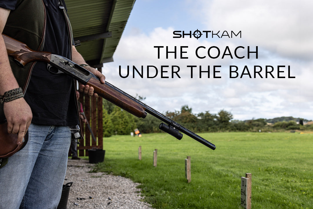 Improving trapshooting in Australia: Shooter with a ShotKam-attached shotgun, focusing on the role of a coach under the barrel.