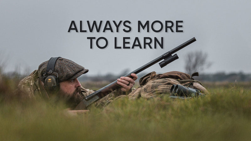 ShotKam Content and Social Media Manager Tom Sykes preparing to shoot from a concealed position in the field.