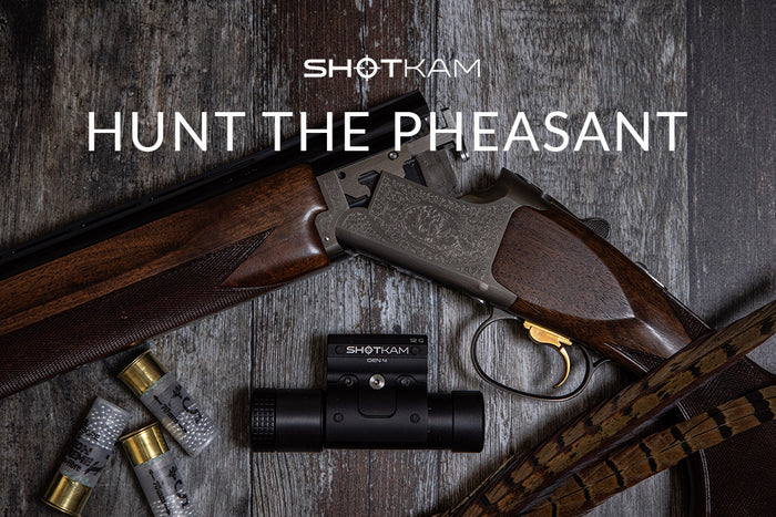 Australian upland hunting equipment with a ShotKam Gen 4, shotgun, and cartridges, geared for successful pheasant hunting.