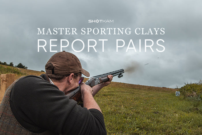 Close-up of competitive clay shooter using over-under shotgun and ShotKam for report pair training