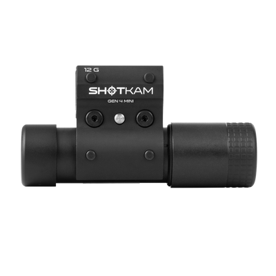 Front view of the ShotKam Gen 4 Mini camera, highlighting the lens and mounting bracket against a plain background.