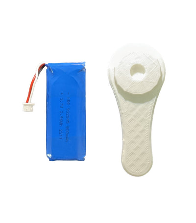 Close-up view of a blue lithium-ion battery pack with red and white wires attached to a white connector, alongside a white 3D-printed tool designed for easy battery installation and removal.